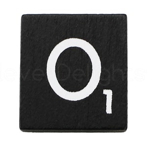 May include: Black wooden tile with a white letter O and the number 1 printed on it.