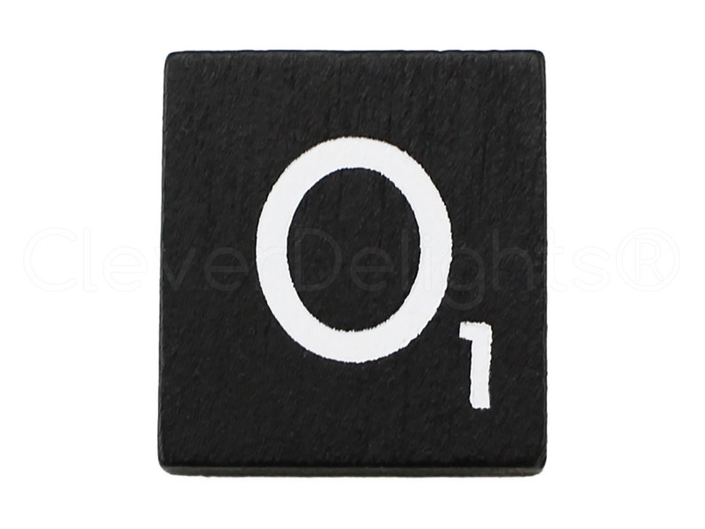 May include: Black wooden tile with a white letter O and the number 1 printed on it.