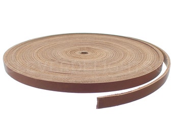 May include: A roll of brown leather cord, coiled and ready to be used for crafting projects.