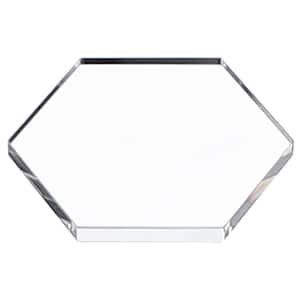 May include: A clear, hexagonal acrylic display stand. The edges are polished, reflecting light. The stand is designed to showcase products. The text "LE VERDELIGHTS" is visible in the background.