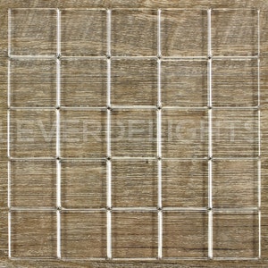 May include: A clear, grid-like object composed of 25 individual squares, each with a transparent border. The object is set against a wooden background. The text "CLEVER DELIGHT" is visible in the lower right corner.