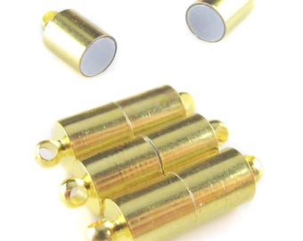 May include: Gold magnetic clasps for jewelry making. The clasps are cylindrical and have a smooth, polished finish. They are designed to be used with necklaces, bracelets, and other jewelry pieces.