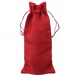 May include: Red burlap drawstring bag. The bag is made of a natural fabric and has a rustic look.