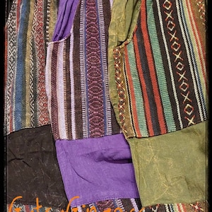 May include: A pair of patchwork trousers with a variety of colourful stripes and patterns. The trousers are made of a soft, comfortable fabric and have a relaxed fit.