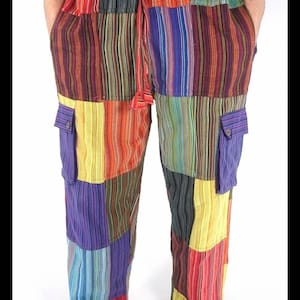 May include: Multicoloured striped patchwork trousers with a drawstring waist and two cargo pockets. The trousers are made of a soft, comfortable fabric and have a relaxed fit.