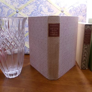 The Lives of The Twelve Caesars by Gaius Suetonis Transquillus. Translation by Philemon Holland. The Heritage Press, NY 1965. Near Fine.