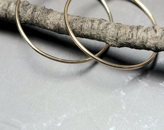 thin gold hoop earrings hammered or smooth 18 gauge hoops