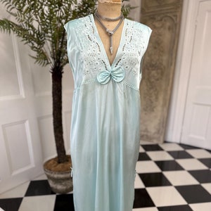 1980s seafoam green long dress with embroidery and plunge neckline