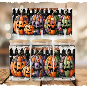May include: Glass tumblers with wooden lids and straws feature a Halloween-themed design. The design includes patchwork pumpkins in orange, purple, and green, with the text "The Pumpkin Patch" on the background and the tumblers.