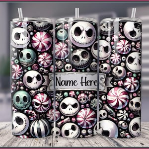May include: Three stainless steel tumblers with a black and white design featuring a cartoon character with candy canes and peppermint swirls. The middle tumbler has the text "Name Here" printed on it.
