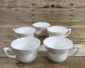 Set med 5 vintage tekoppar, benvita