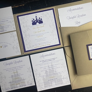 May include: Elegant wedding invitation suite with a gold and purple color scheme. The invitation features a castle graphic and the names "Gina" and "Tyler". Includes RSVP, reception, and accommodation cards.