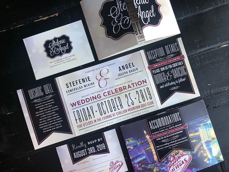 May include: Wedding invitation suite with black and white design featuring a script font with the names "Stefenie & Angel" and the date "Friday - October 25, 2019". The invitation includes details about the wedding ceremony and reception, as well as accommodation information.