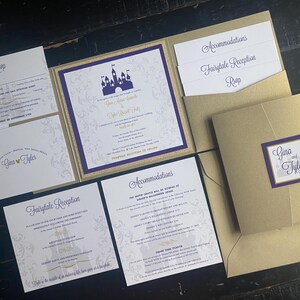 May include: Elegant wedding invitation suite with a gold and purple color scheme. The invitation features a castle silhouette and includes RSVP, reception, and accommodation details. The suite is presented on a dark wooden surface.