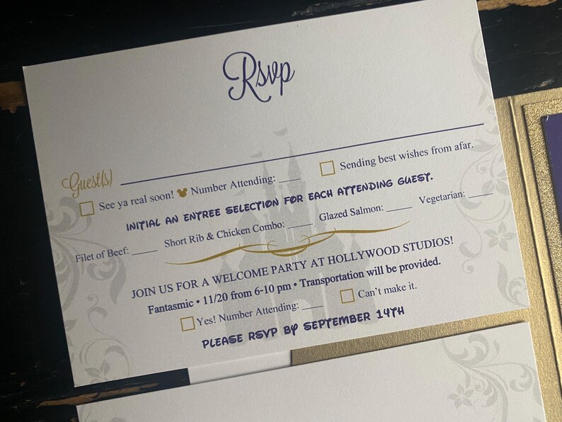 May include: White RSVP card with gold and purple accents. The card includes fill-in-the-blank sections for guest names, meal selections, and attendance confirmation. The text includes "Guests", "Rsvp", and "Welcome Party at Hollywood Studios!"