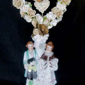 Wedding cake topper. Vintage porcelain bride and groom in French country 1700s style, paper flowers, heart arch and Just Married sign. image 1
