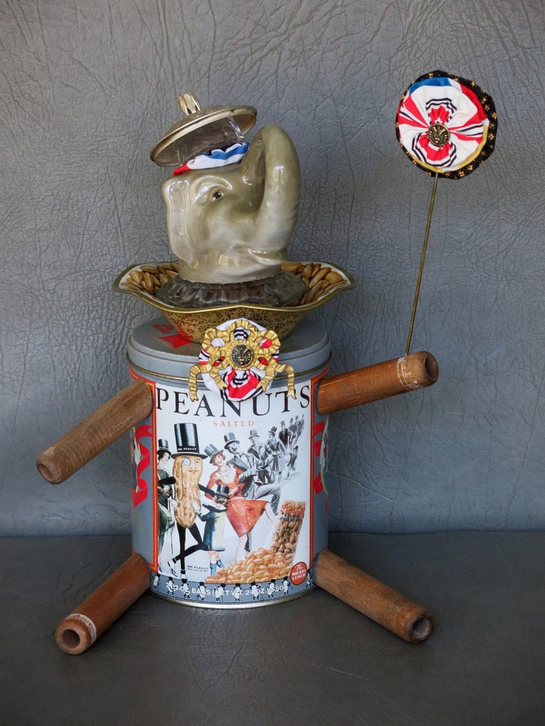 One-of-a-kind assemblage elephant, Peanut. Porcelain head, Planter's Peanuts tin body, bobbin legs, crystal and brass embellishments. image 2