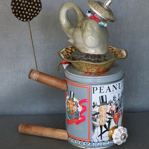 One-of-a-kind assemblage elephant, Peanut. Porcelain head, Planter's Peanuts tin body, bobbin legs, crystal and brass embellishments. image 10