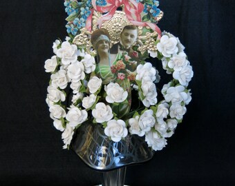 1920s style Wedding or Anniversary cake topper. Victorian vase with paper craft collage of flowers, Bride and Groom, doves and ribbons.