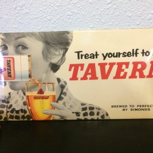May include: A vintage advertisement for Tavern beer featuring a woman pouring a glass of beer. The ad features the text "Treat yourself to a Tavern" and "Brewed to perfection by Simonds".