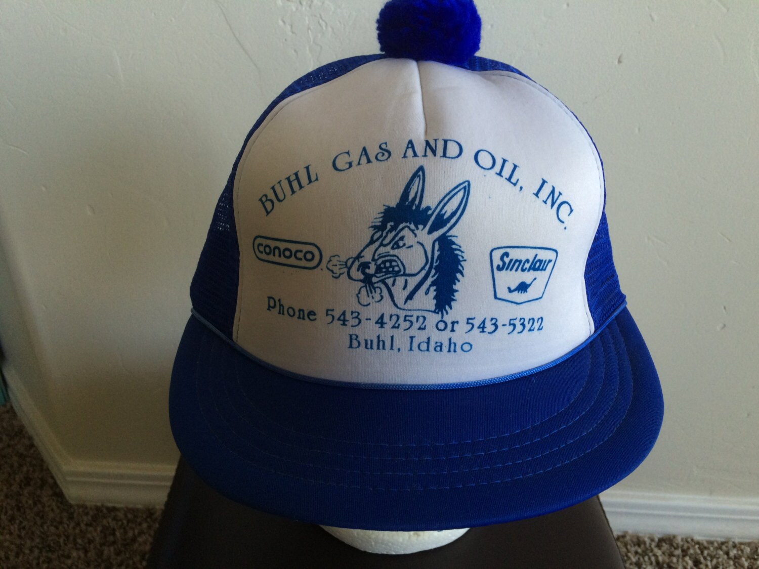 baseball cap with puffball