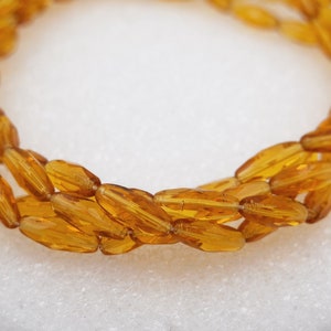 Spaghetti Glass Bead 15mm Faceted Oval Topaz 12 pcs