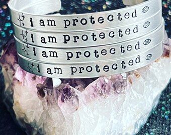 I Am Protected Aluminum Cuff Bracelet - Typewriter Font