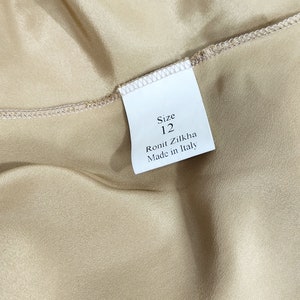 May include: A white tag with black text that reads "Size 12", "Ronit Zilkha", and "Made in Italy".