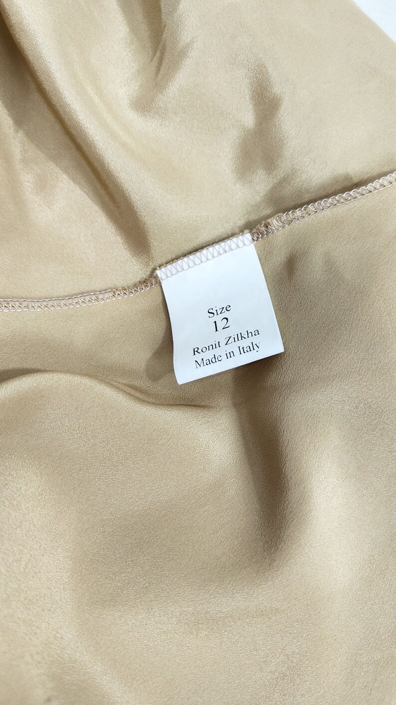 May include: A white tag with black text that reads "Size 12", "Ronit Zilkha", and "Made in Italy".