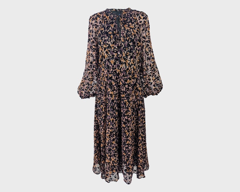 May include: A long-sleeved, midi-length dress with a black and brown leopard print. The dress has a gathered neckline and a slightly puffed sleeve.