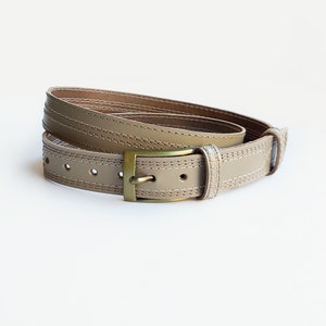 Beige leather jeans belt with brass buckle