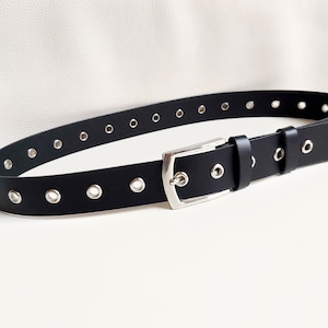 Silver eyelet waist and hip jeans belt in black genuine leather
