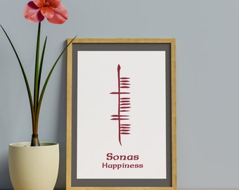 May include: A framed print with a red symbol and the words "Sonas Happiness" in a white font. The frame is brown wood and the background is a light gray wall.