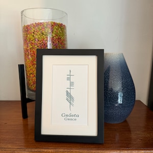 Ogham Grace Framed Print in Irish Gaelic
