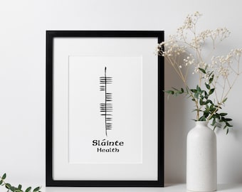 May include: Black and white framed print with a stylized design and the words "Sláinte Health" in black text.