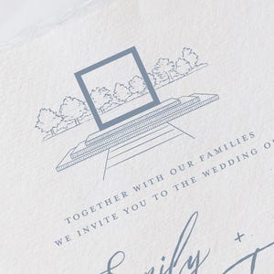 May include: A wedding invitation with a light blue architectural illustration and text. The invitation features a square design with a building and trees, along with the names "Emily" and "Trevor" in cursive script. The text reads "Together with our families, we invite you to the wedding of."