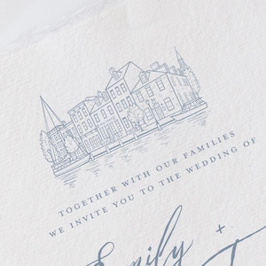 May include: A white textured paper wedding invitation featuring a blue line drawing of canal houses and a boat. The text reads: TOGETHER WITH OUR FAMILIES WE INVITE YOU TO THE WEDDING OF Emily + Trevor. The paper has a rough, deckled edge finish.