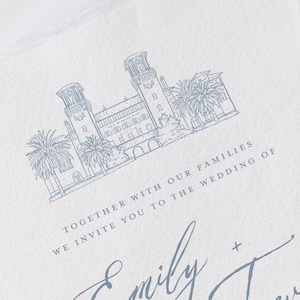 May include: A wedding invitation with a blue illustration of a building with two towers and palm trees. The text reads "Together with our families we invite you to the wedding of Emily + Trevor".