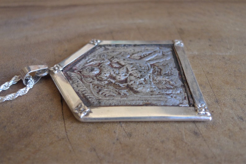 Temple pendant depicting Kandoba from India