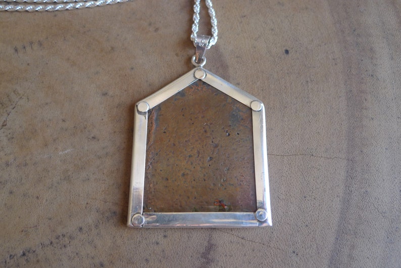 Temple pendant depicting Kandoba from India