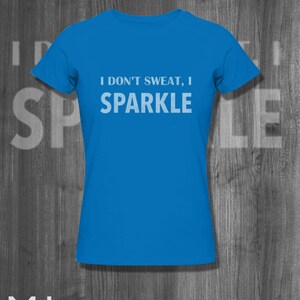 May include: A bright blue t-shirt with the text "I don't sweat, I sparkle" in white.