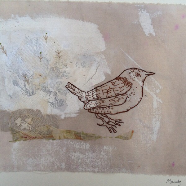 Unframed textile picture of wren