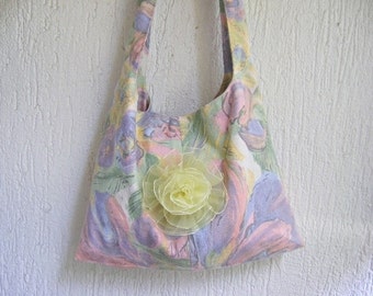 Pastel colored shoulder bag decorated with a yellow rose