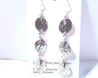 Sterling Silver earrings embellished with 3 leaves 2.5 inches in length