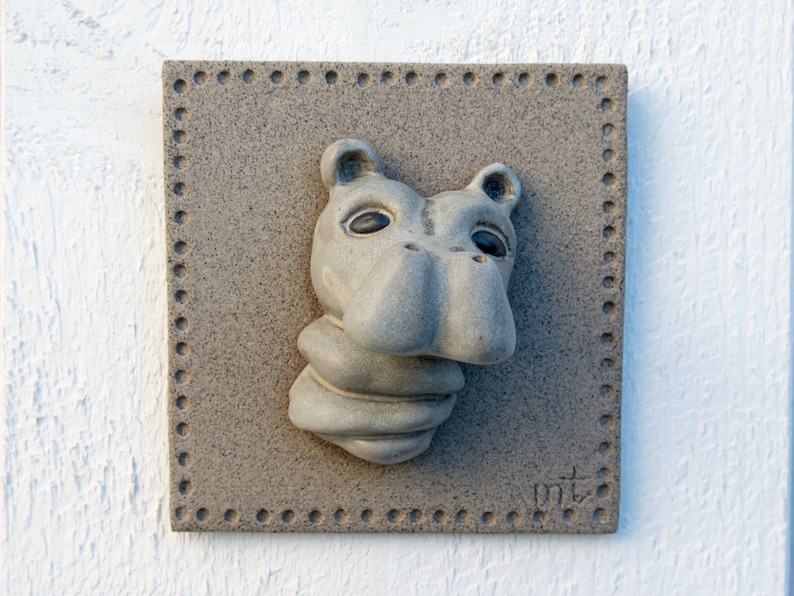 Portrait of a baby Hippo on a ceramic tile