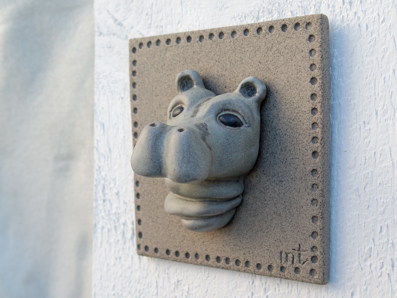 Portrait of a baby Hippo on a ceramic tile