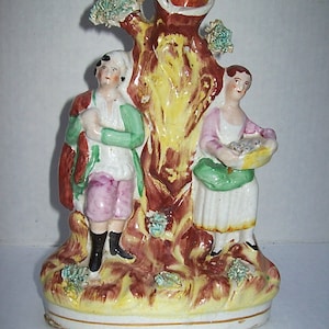Antique STAFFORDSHIRE POTTERY VASE with Hunter and Fish Monger standing beside Tree
