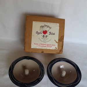 May include: A set of three ceramic mugs with a speckled, matte finish. The mugs are in shades of cream, light gray, and dark gray. Each mug has a simple, minimalist design, perfect for coffee or tea.