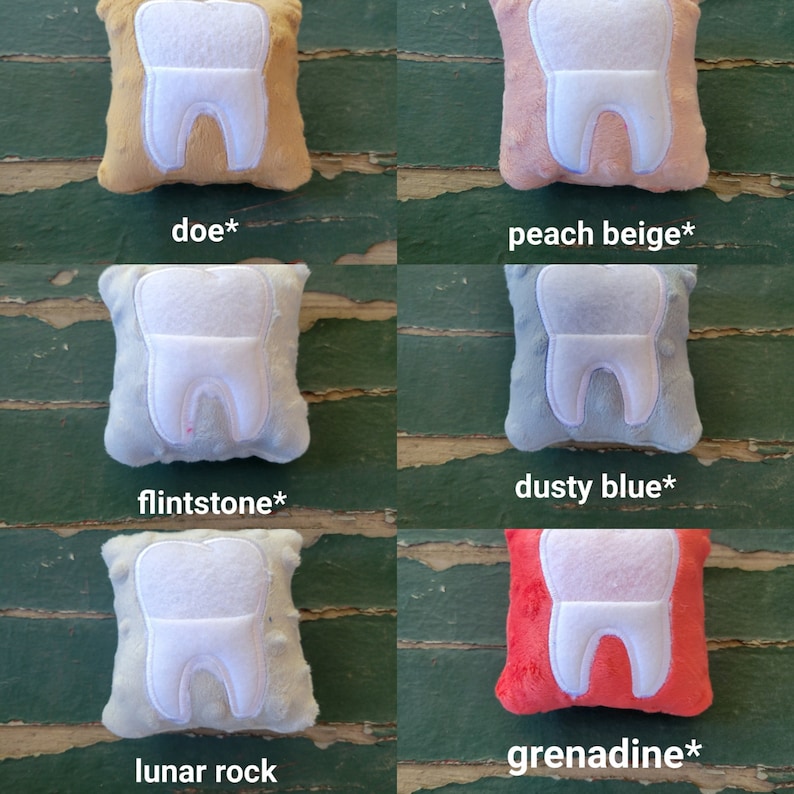May include: Six plush tooth pillows in different colours: doe*, peach beige*, flintstone*, dusty blue*, lunar rock, and grenadine*. Each pillow is a small square with a white tooth shape in the centre.