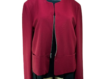 May include: A burgundy blazer with a zipper closure and two pockets. The blazer has a round neckline and long sleeves.